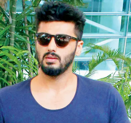 Arjun Kapoor, a prominent Bollywood actor, posing at a promotional event, showcasing his charismatic personality.