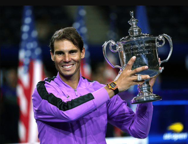 Rafael Nadal in action during a tennis match, showcasing his powerful forehand and athleticism on court.